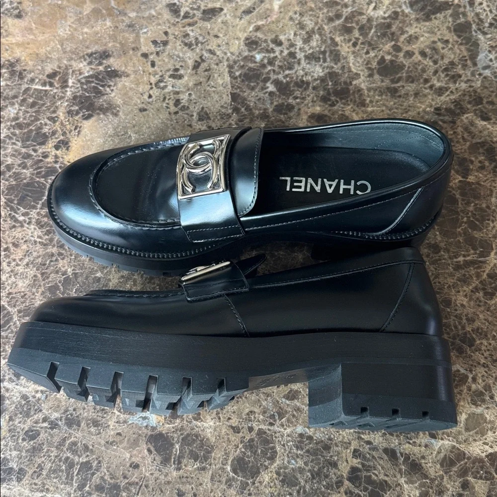 Chanel black shiny calf loafers moccasins chunky flats silver logo sz 37.5